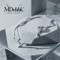 *MDvbbk Silver-Tone Sculptural Wave Chain Necklace with Double Loop Detail*